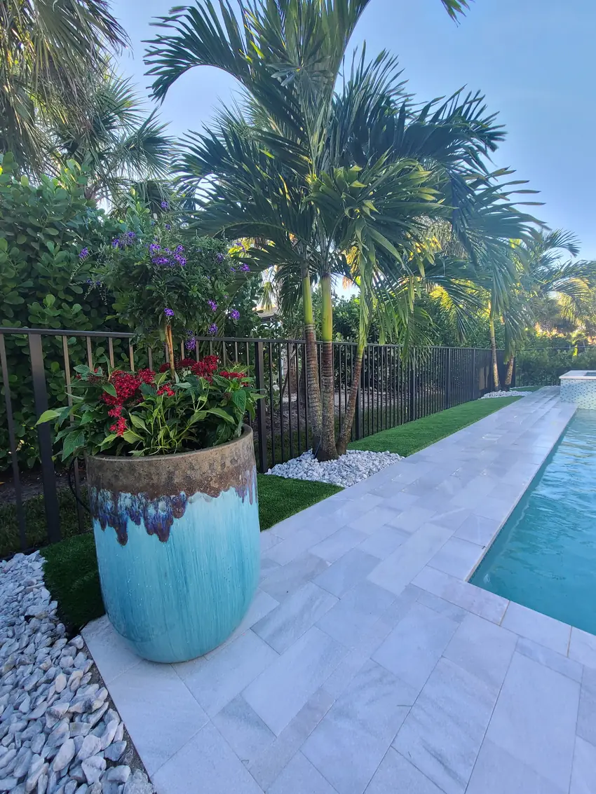 Poolside planting bed and marble pool deck